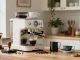 Barista using ROKOK88 espresso machine to craft perfect espresso.